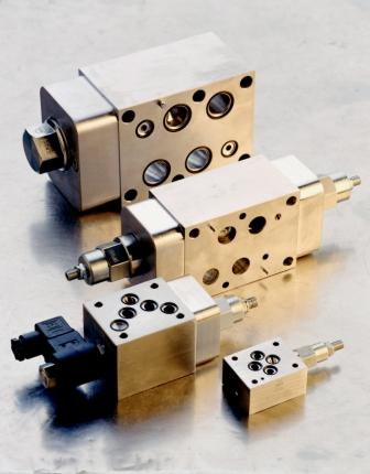 Sandwich manifolds for check valves
